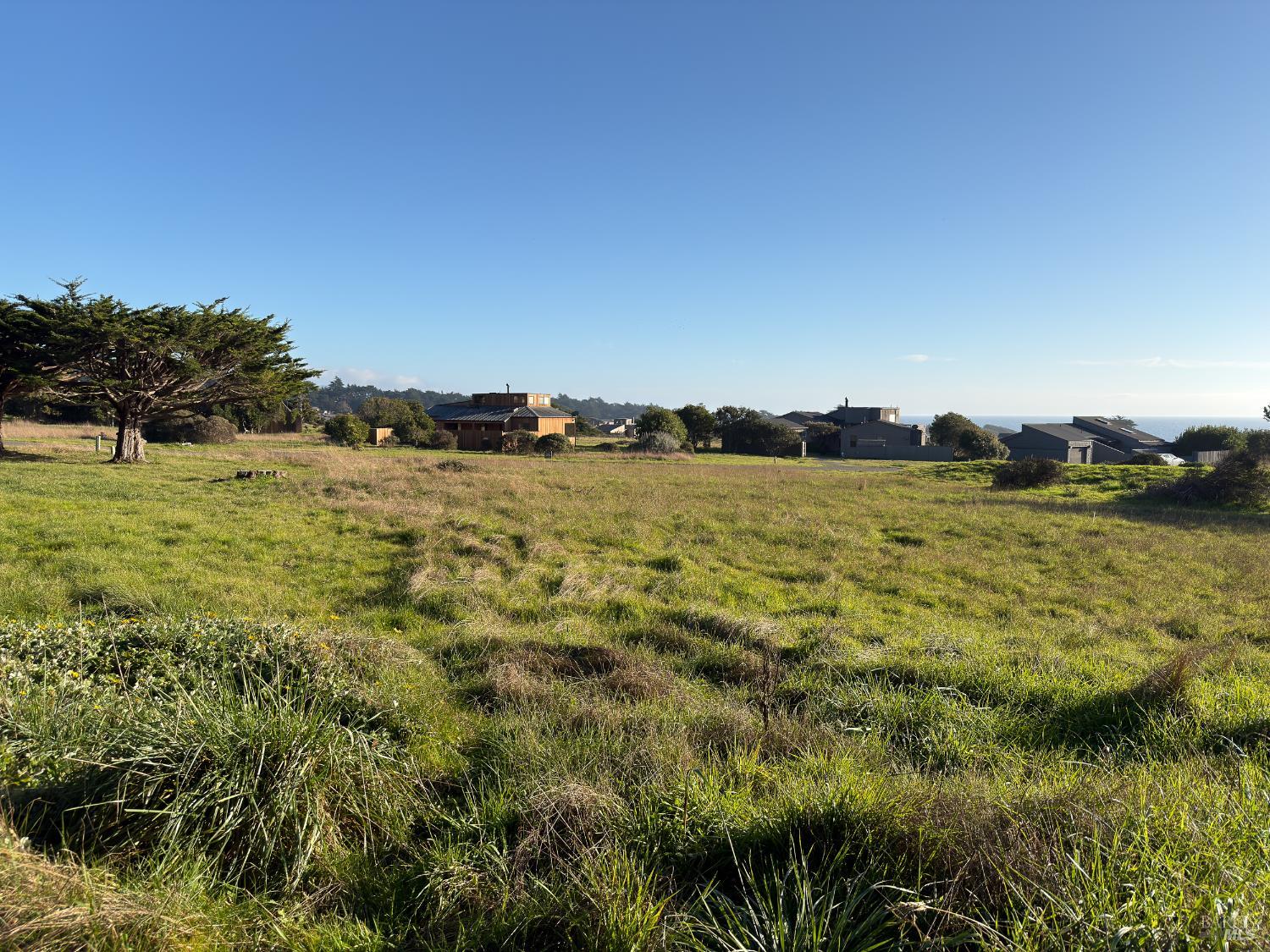 41 Sea Pine The Sea Ranch, CA 95497 - Photo 6 of 17 a view of a lake with houses in the background