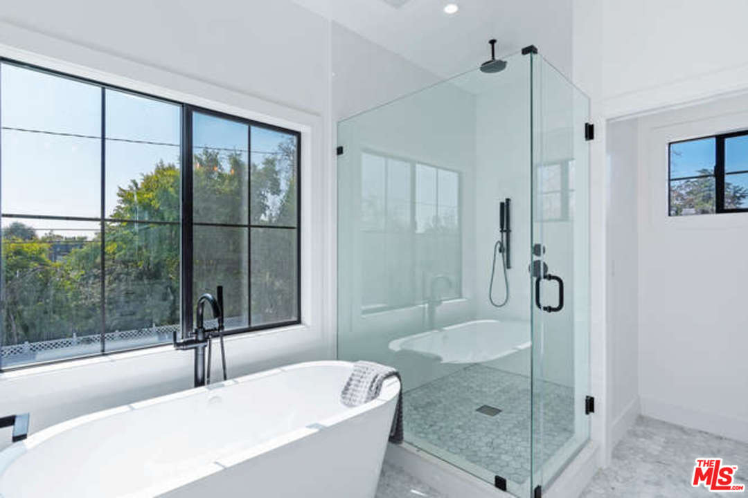 3628 Grayburn Road Pasadena, CA 91107 - Photo 15 of 25 a bathroom with a granite countertop tub shower and sink