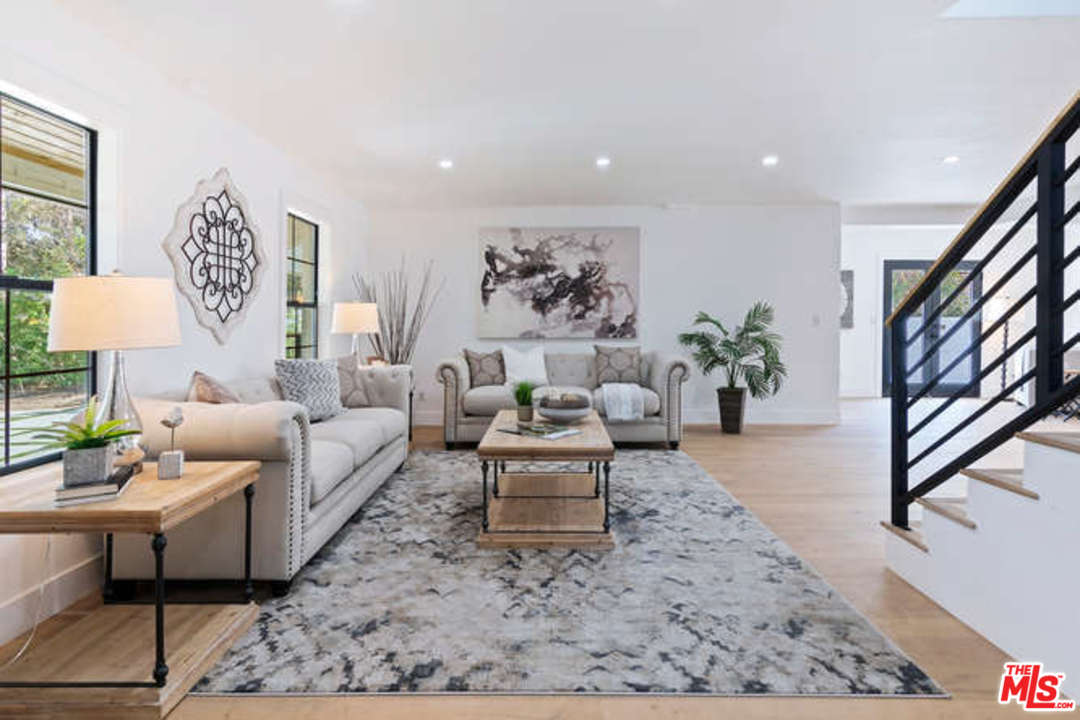3628 Grayburn Road Pasadena, CA 91107 - Photo 3 of 25 a living room with furniture and a rug
