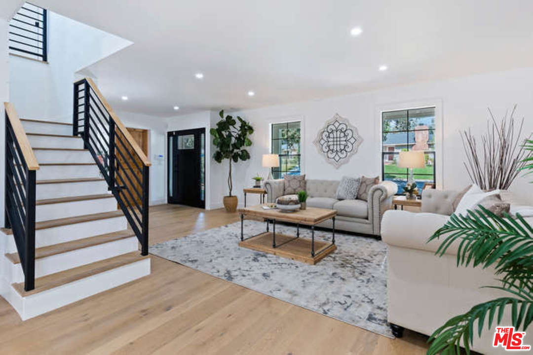 3628 Grayburn Road Pasadena, CA 91107 - Photo 4 of 25 a living room with furniture and a wooden floor