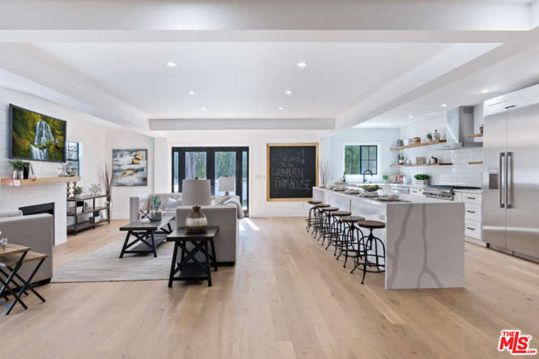 3628 Grayburn Road Pasadena, CA 91107 - Photo 5 of 25 a living room with furniture and a large window