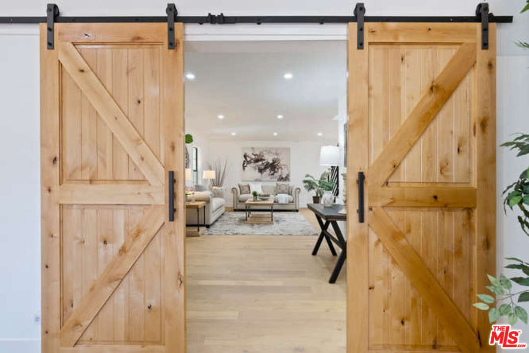 3628 Grayburn Road Pasadena, CA 91107 - Photo 10 of 25 a living room with white walls and furniture