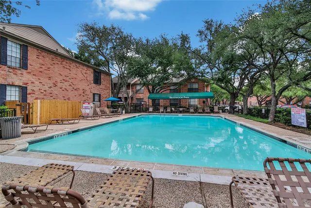 a front view of a building with garden