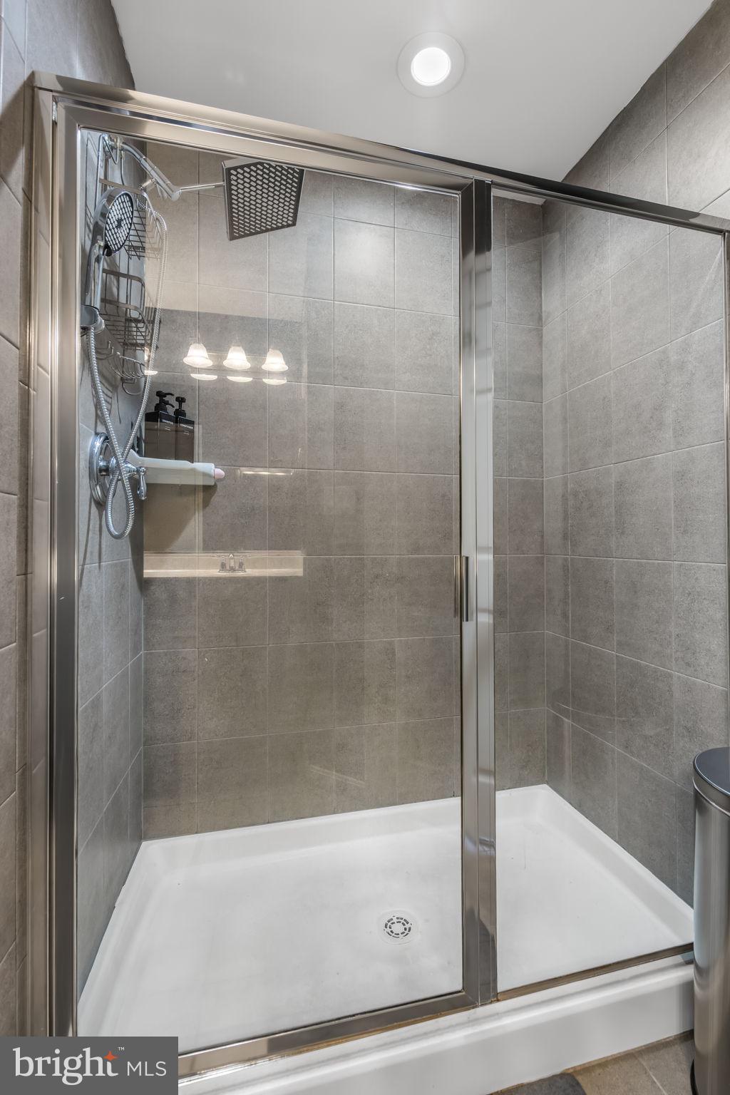 4719 Wensel Road Fredericksburg, VA 22408 - Photo 22 of 36 Sleek modern shower with elegant tiles.