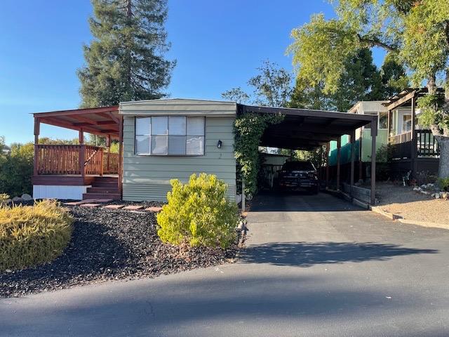 a front view of a house with a yard and a garage