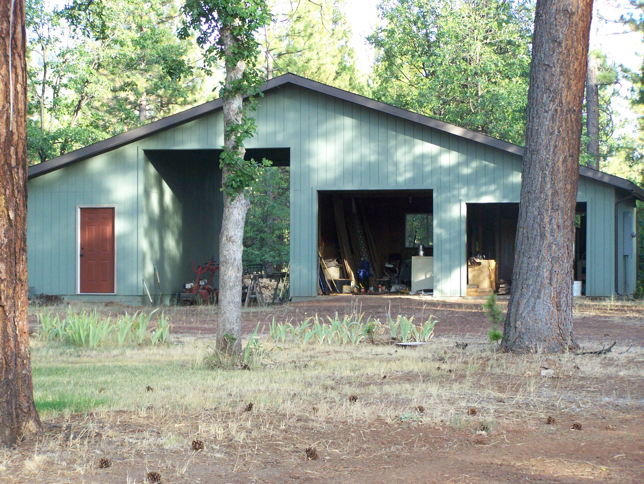 315 Schneider Ranch Road McArthur, CA 96056 - Photo 4 of 16 a front view of a house with garden