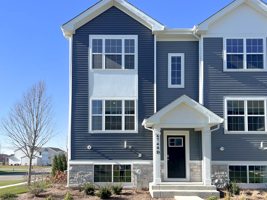 a front view of a house with glass windows