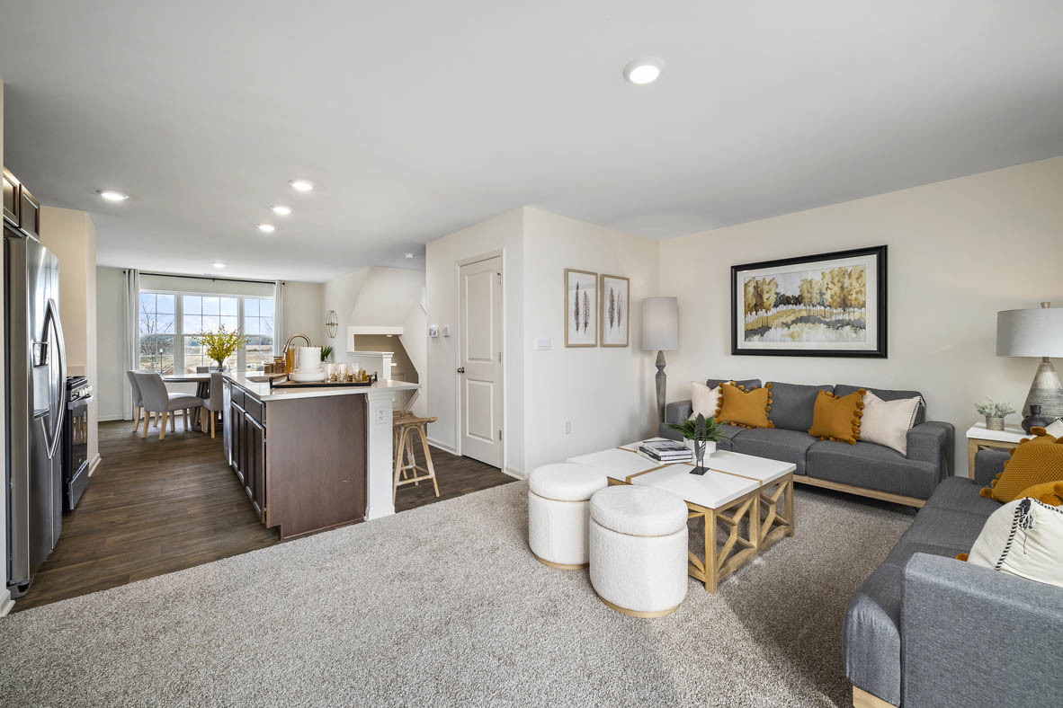 6740 Linden Trail, Unit D Wonder Lake, IL 60097 - Photo 20 of 55 a living room with furniture and a dining table with kitchen view
