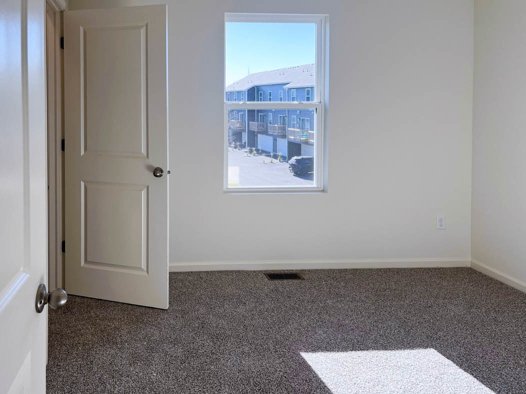 6740 Linden Trail, Unit D Wonder Lake, IL 60097 - Photo 7 of 55 an empty room with a window