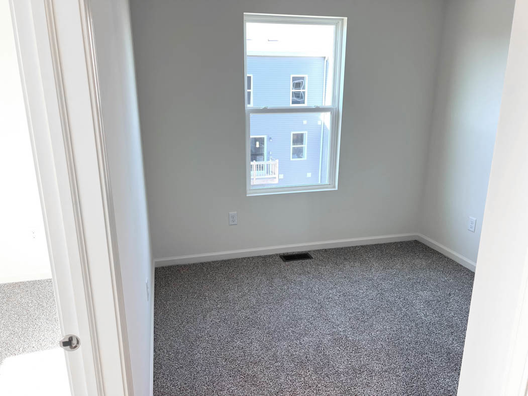 6740 Linden Trail, Unit D Wonder Lake, IL 60097 - Photo 8 of 55 a view of an empty room with a window