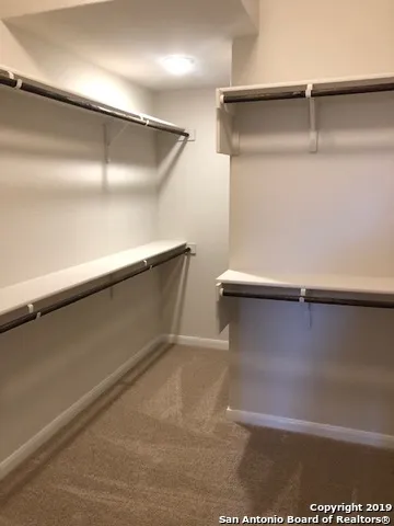 an empty room with wooden floor