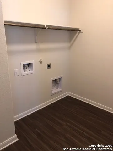 a view of gallery with wooden floor