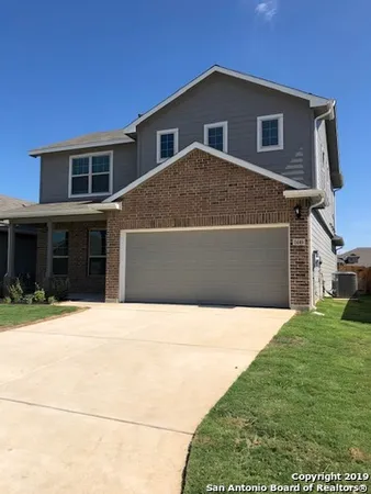 a house view with a garden space