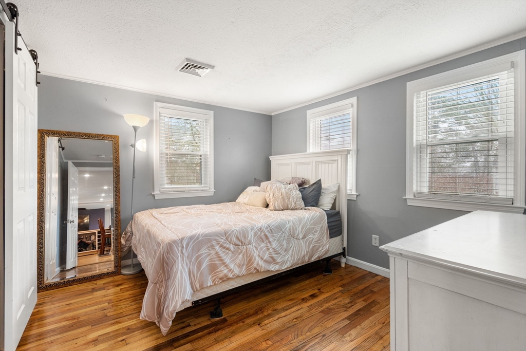 2 Taylor Road Yarmouth, MA 02664 - Photo 19 of 34 a bedroom with a bed and window