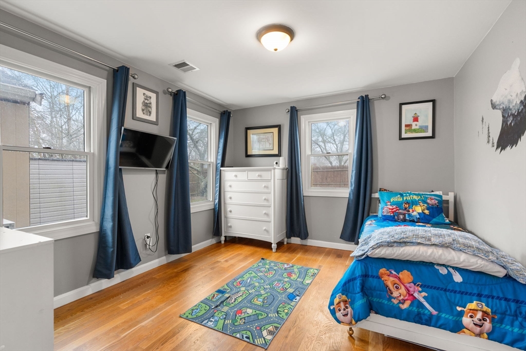 2 Taylor Road Yarmouth, MA 02664 - Photo 20 of 34 a bedroom with a bed and a dresser in it