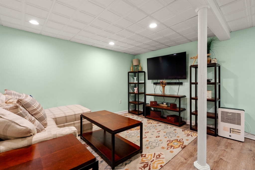 2 Taylor Road Yarmouth, MA 02664 - Photo 26 of 34 a living room with furniture and a flat screen tv