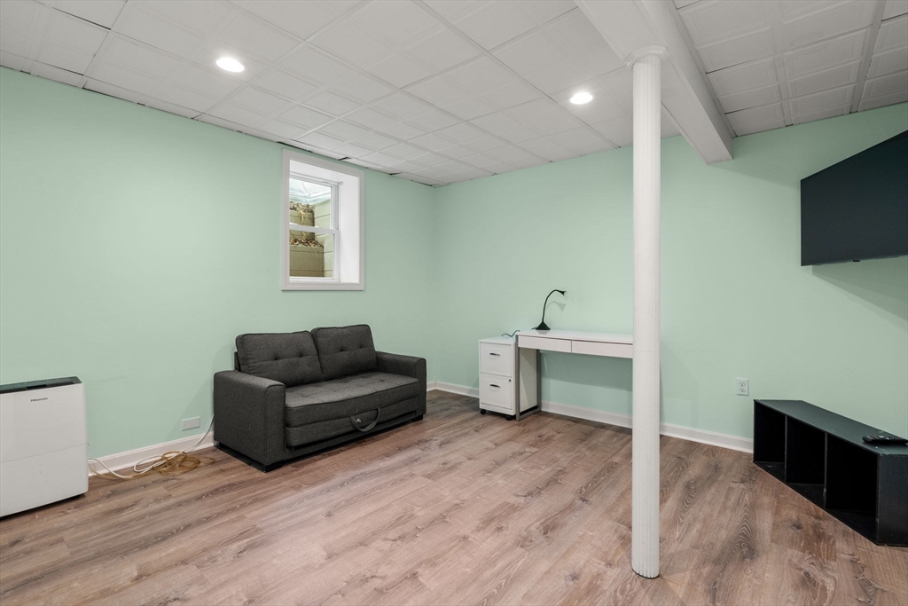 2 Taylor Road Yarmouth, MA 02664 - Photo 28 of 34 a living room with furniture and a wooden floor
