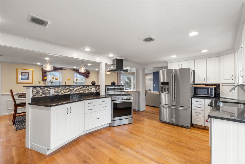 2 Taylor Road Yarmouth, MA 02664 - Photo 7 of 34 a kitchen with granite countertop a refrigerator and a stove top oven