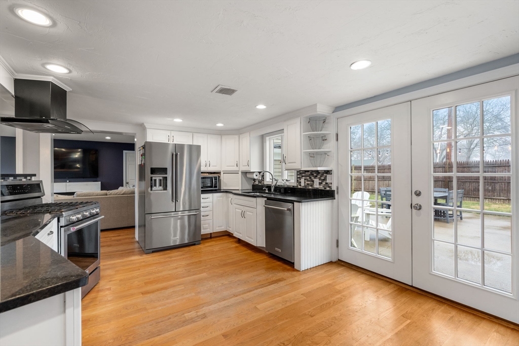 2 Taylor Road Yarmouth, MA 02664 - Photo 8 of 34 a kitchen with stainless steel appliances kitchen island granite countertop a refrigerator and a stove top oven