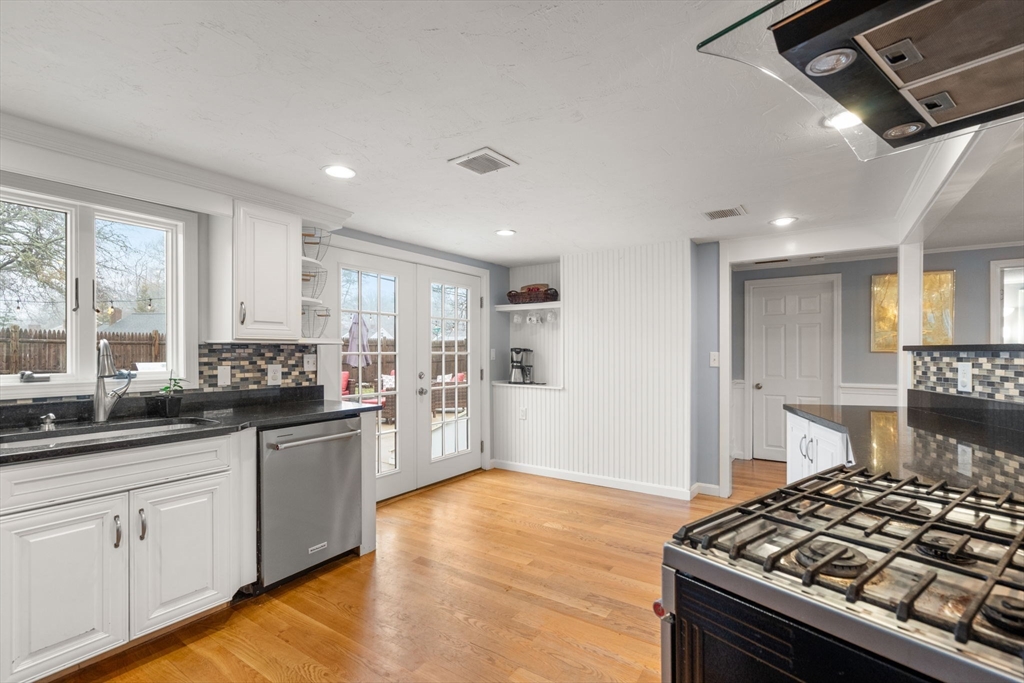 2 Taylor Road Yarmouth, MA 02664 - Photo 9 of 34 a kitchen with stainless steel appliances granite countertop a sink stove and refrigerator