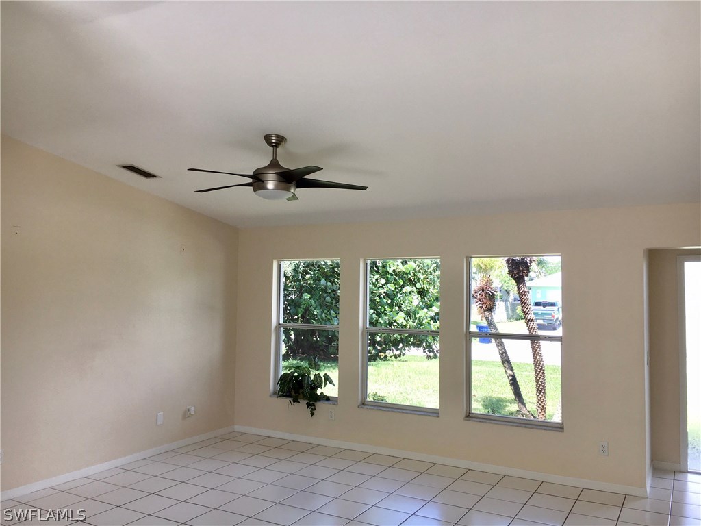 18536 Sebring Road Fort Myers, FL 33967 - Photo 3 of 11 an empty room with windows