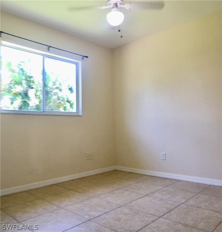 18536 Sebring Road Fort Myers, FL 33967 - Photo 9 of 11 an empty room with a window