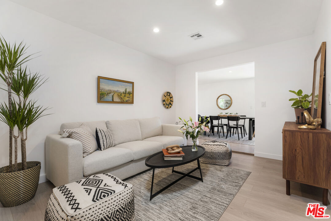 1364 East Woodbury Road Pasadena, CA 91104 - Photo 20 of 50 a living room with furniture and a potted plant