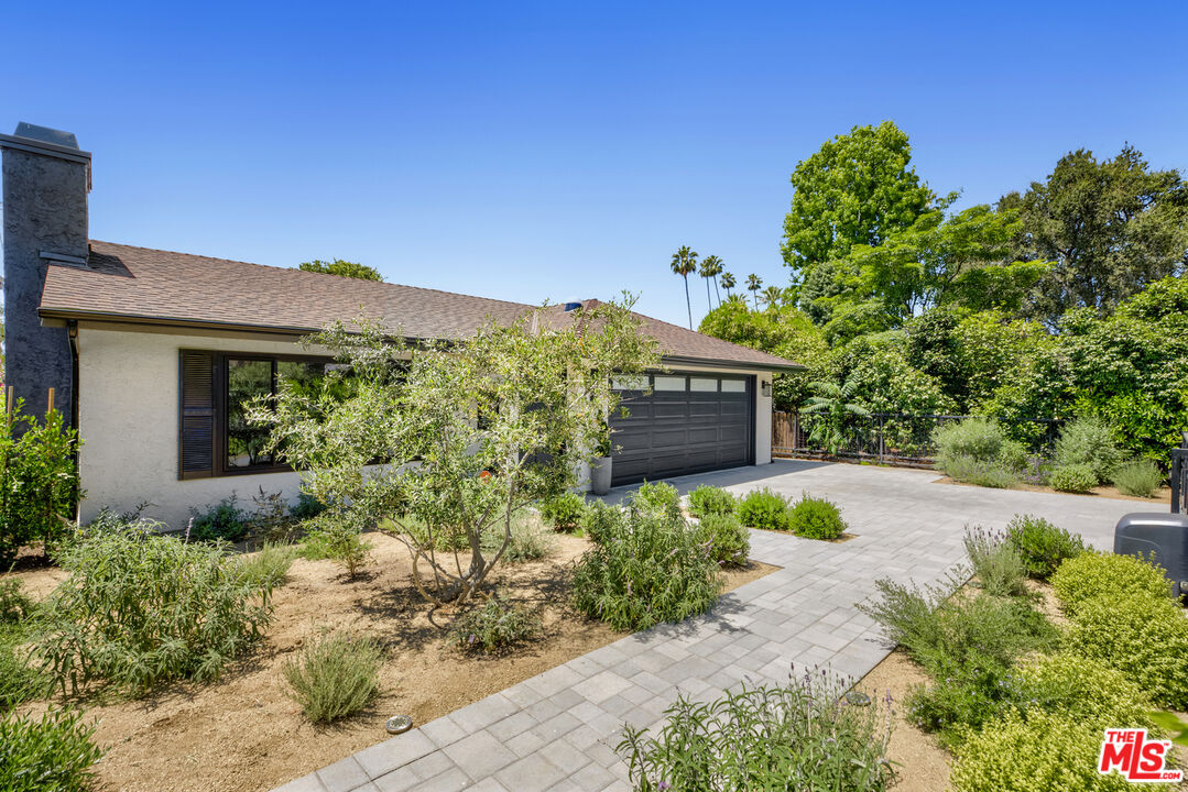 1364 East Woodbury Road Pasadena, CA 91104 - Photo 2 of 50 a front view of a house with a yard