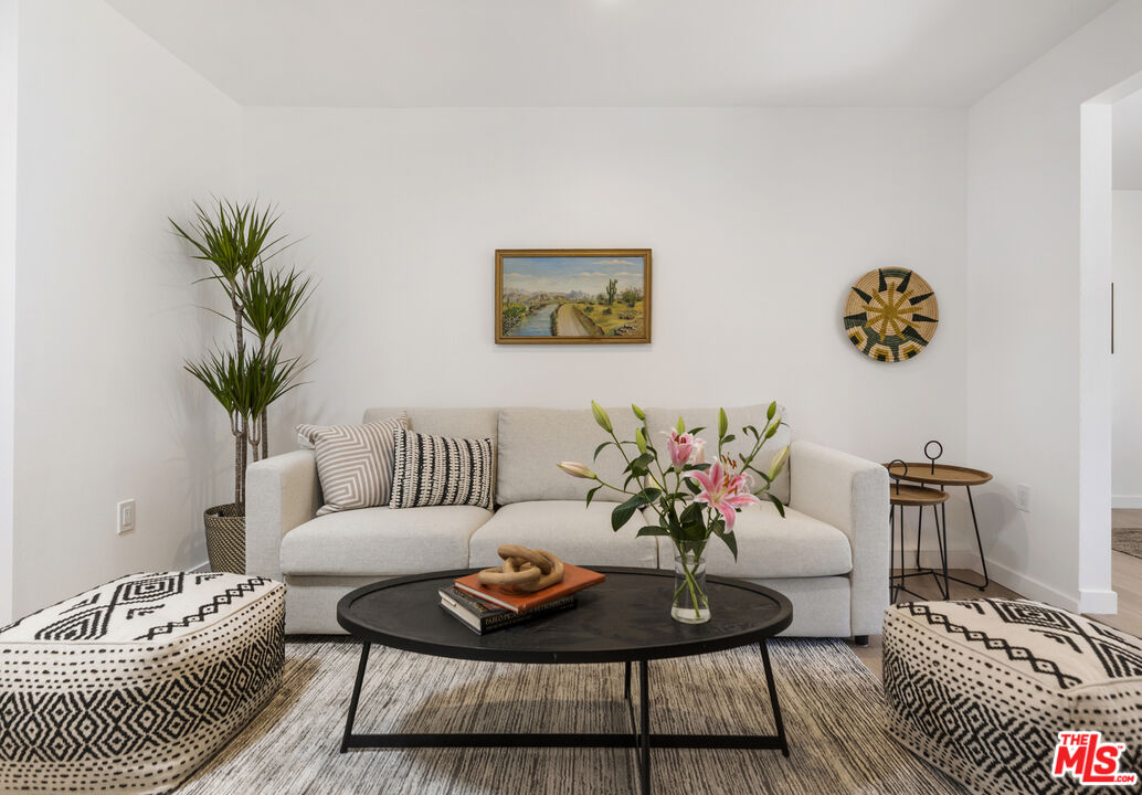 1364 East Woodbury Road Pasadena, CA 91104 - Photo 22 of 50 a living room with furniture and a potted plant