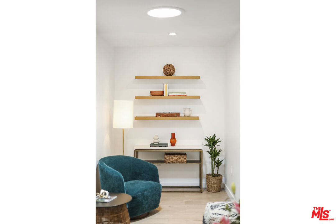1364 East Woodbury Road Pasadena, CA 91104 - Photo 23 of 50 a living room with furniture and a lamp
