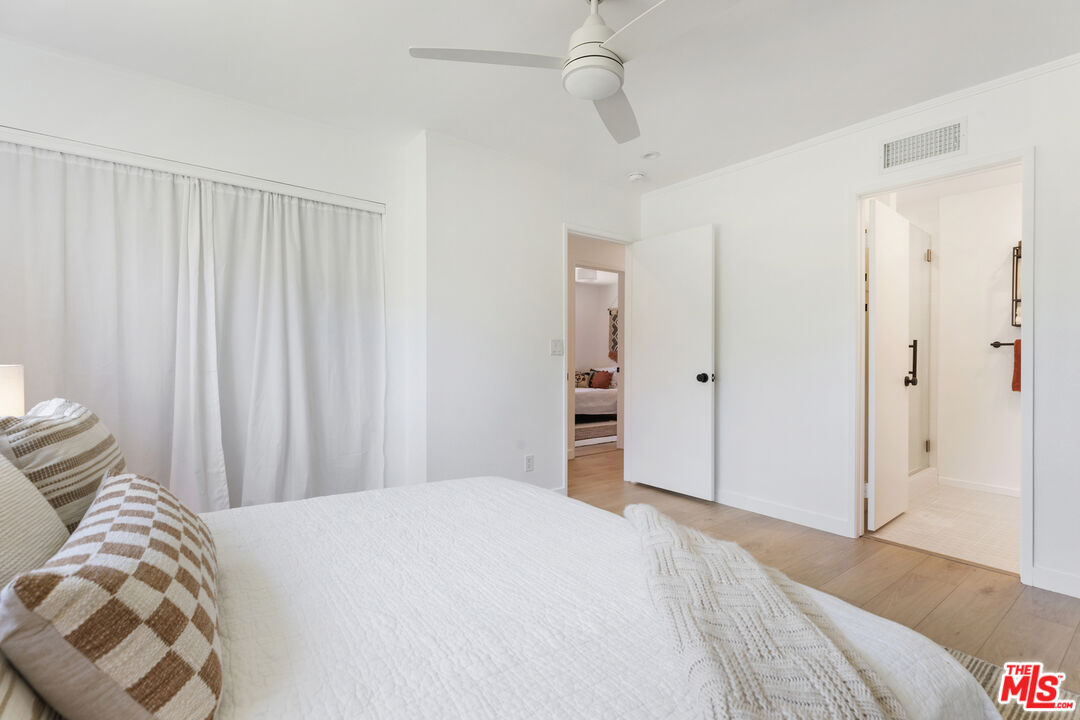 1364 East Woodbury Road Pasadena, CA 91104 - Photo 26 of 50 a bedroom with a bed and a painting on the wall