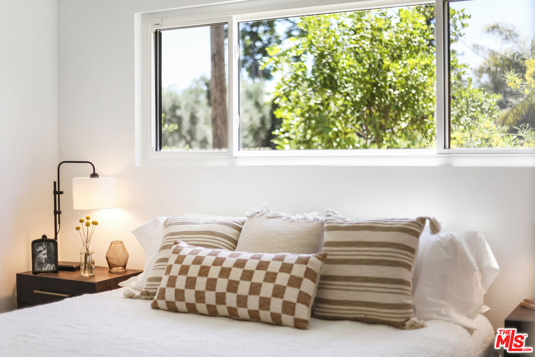 1364 East Woodbury Road Pasadena, CA 91104 - Photo 27 of 50 a bedroom with a bed and a window