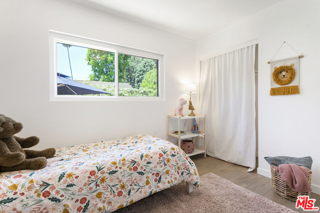 1364 East Woodbury Road Pasadena, CA 91104 - Photo 31 of 50 a bedroom with a bed and a window