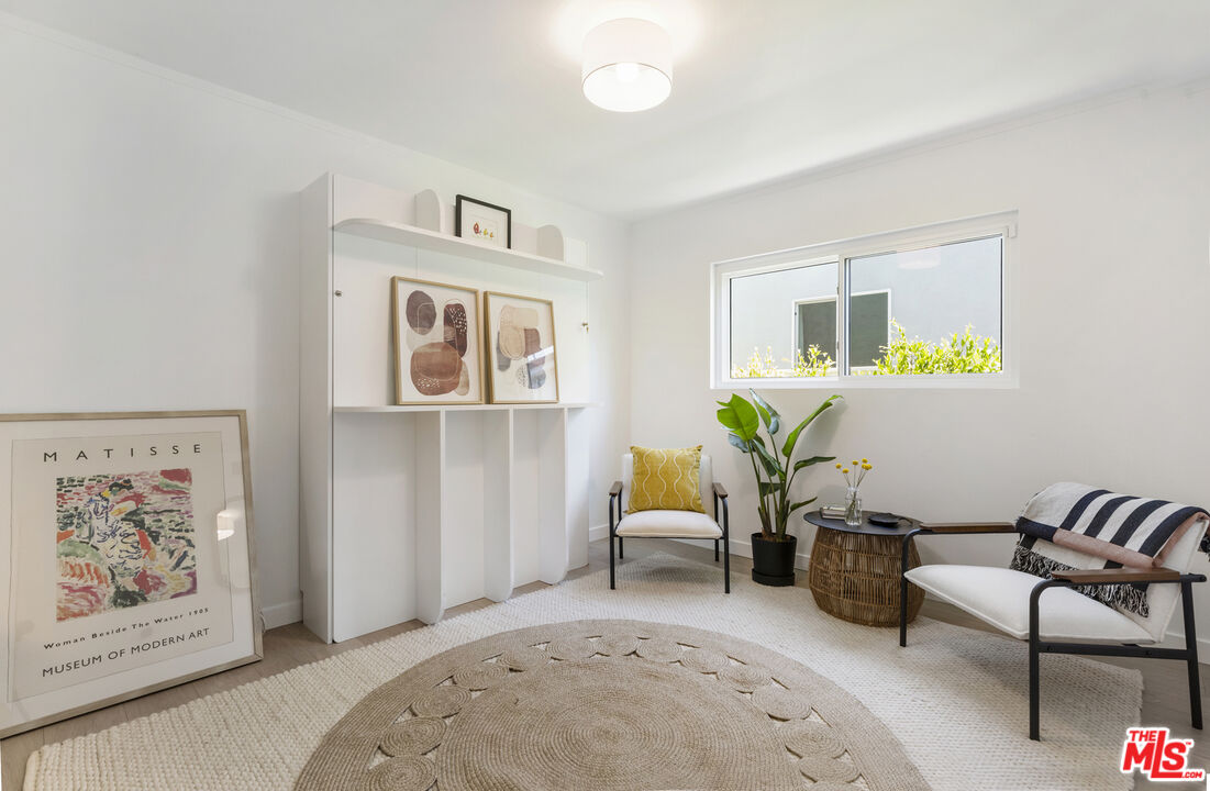 1364 East Woodbury Road Pasadena, CA 91104 - Photo 36 of 50 a living room with furniture and window