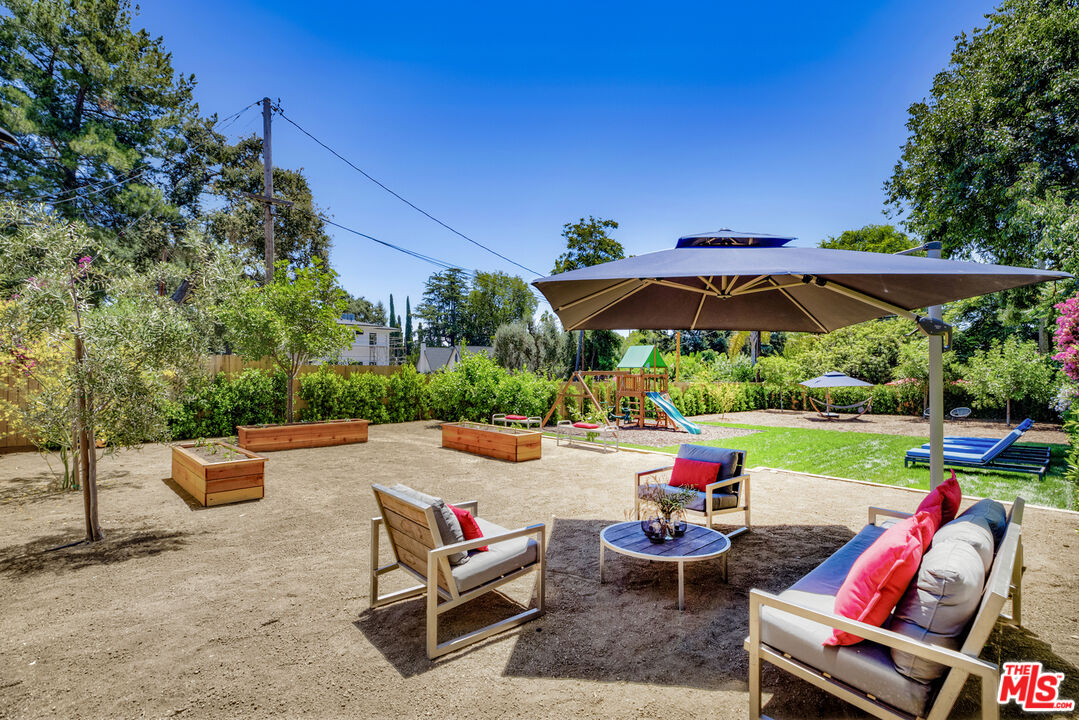 1364 East Woodbury Road Pasadena, CA 91104 - Photo 40 of 50 an outdoor sitting area with furniture and garden view