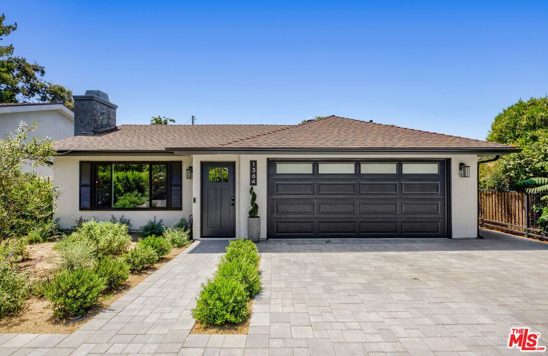 1364 East Woodbury Road Pasadena, CA 91104 - Photo 4 of 50 a front view of a house with a yard