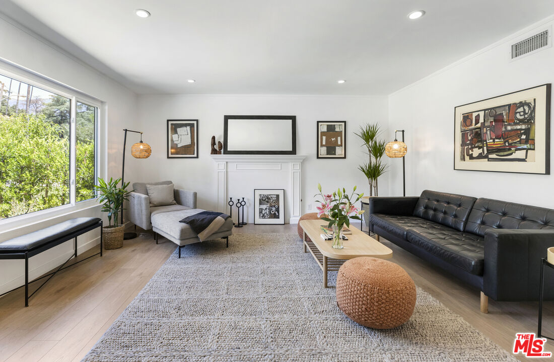 1364 East Woodbury Road Pasadena, CA 91104 - Photo 8 of 50 a living room with furniture and a large window
