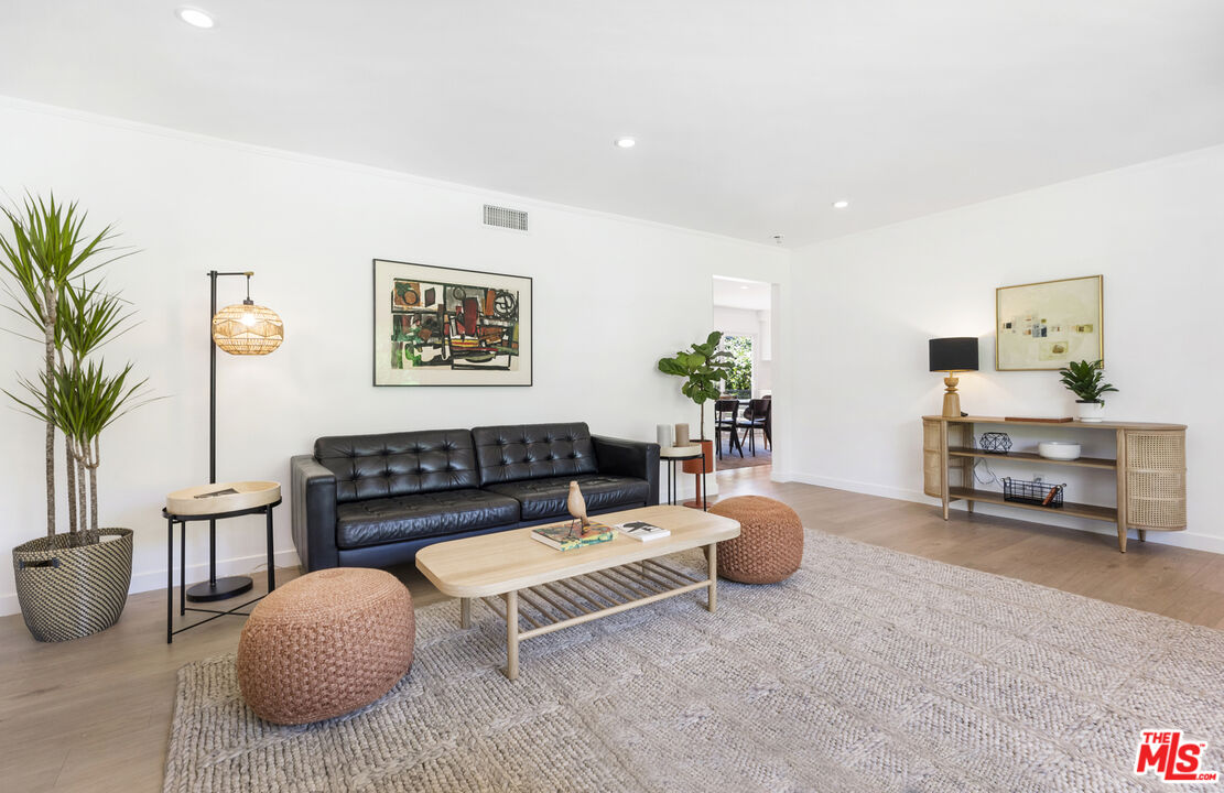 1364 East Woodbury Road Pasadena, CA 91104 - Photo 10 of 50 a living room with furniture and a potted plant