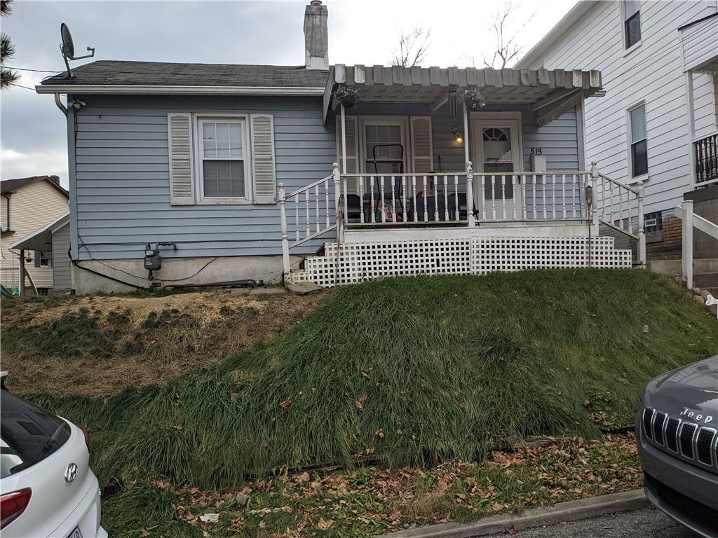 515 East Washington Street Rochester, PA 15074 - Photo 1 of 13 a front view of a house with garden