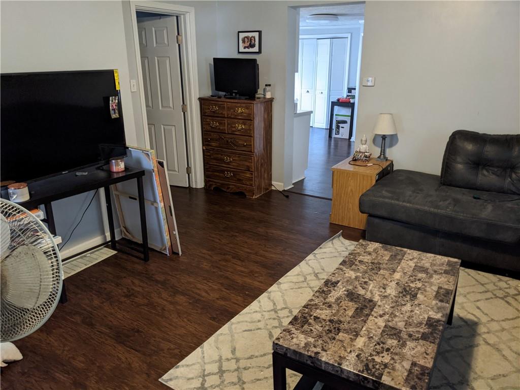 515 East Washington Street Rochester, PA 15074 - Photo 3 of 13 a living room with furniture and a flat screen tv