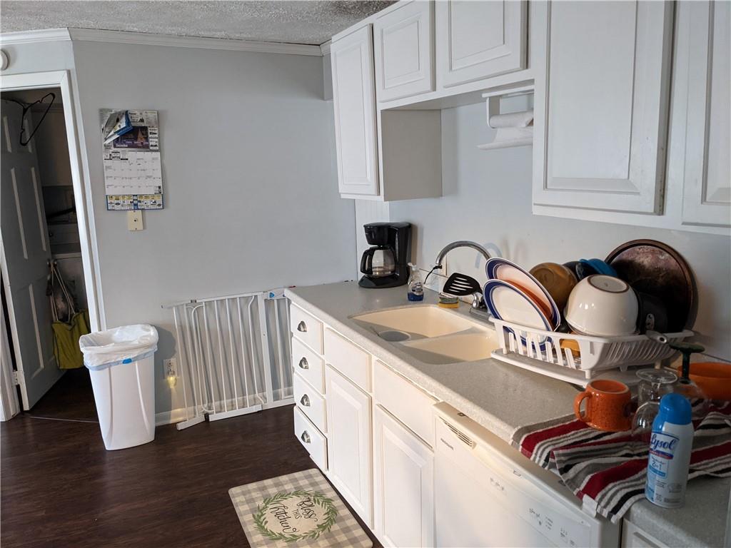 515 East Washington Street Rochester, PA 15074 - Photo 9 of 13 a kitchen with a sink and a stove top oven