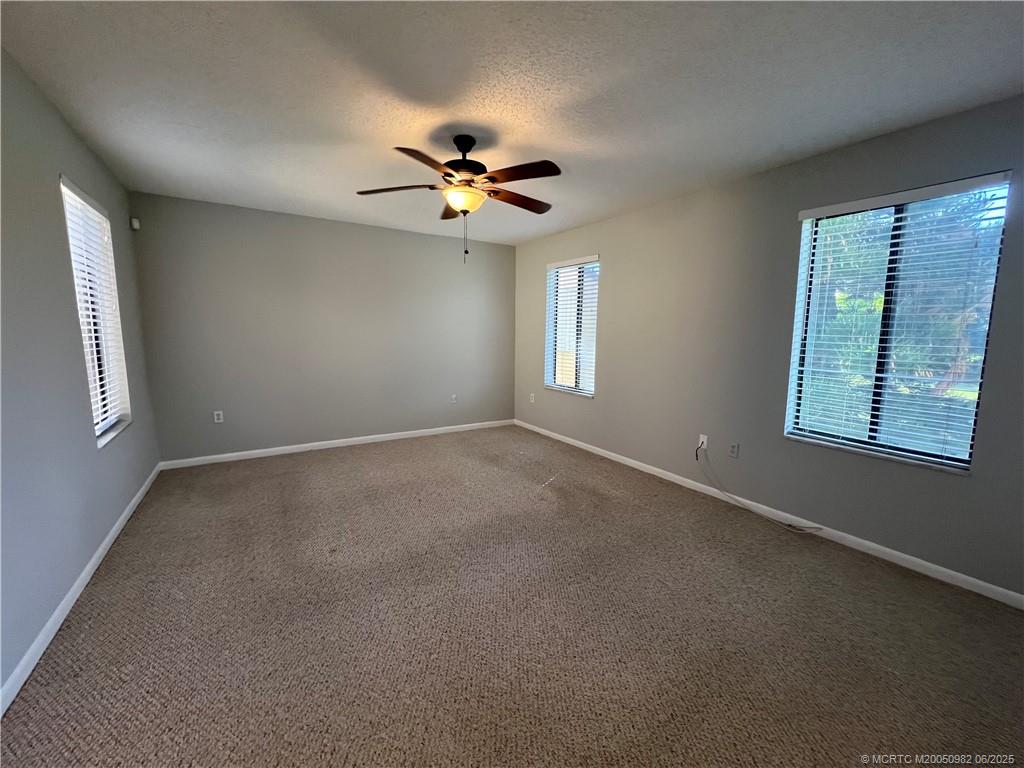 5335 Southeast Miles Grant Road, Unit 214 Stuart, FL 34997 - Photo 12 of 17 a view of an empty room with a window