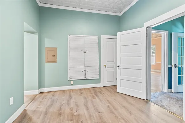 a bathroom with a granite countertop sink and washing machine