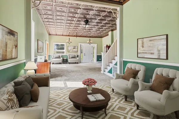 a view of a livingroom with furniture and a fireplace