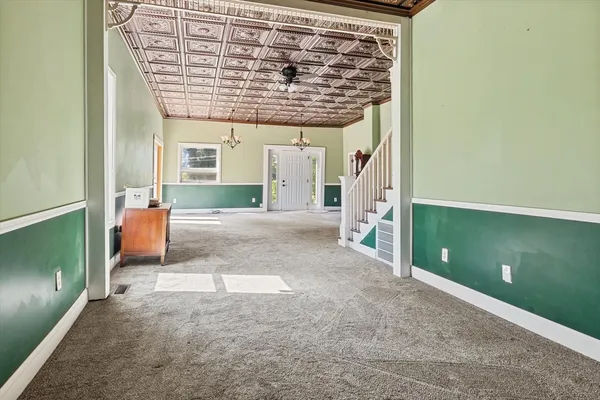 a view of a livingroom with furniture and a fireplace