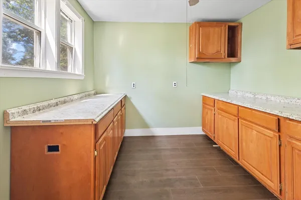 a room with a window and a wooden floor