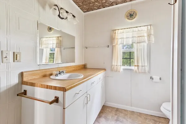 a view of room with window and wooden floor
