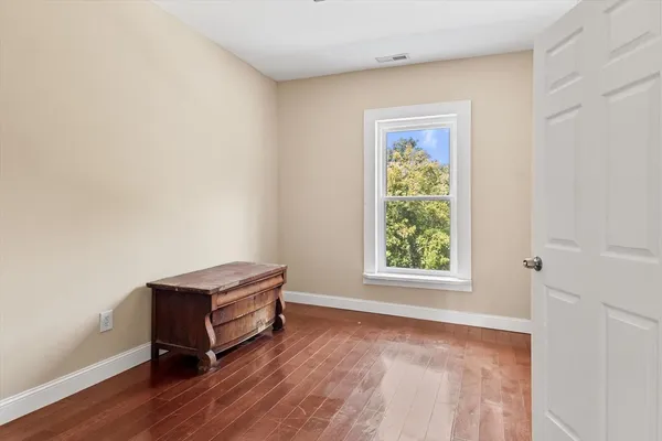 a bathroom with a sink a mirror a vanity and shower