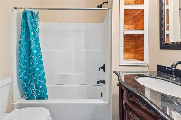 a view of a lake with couches chairs