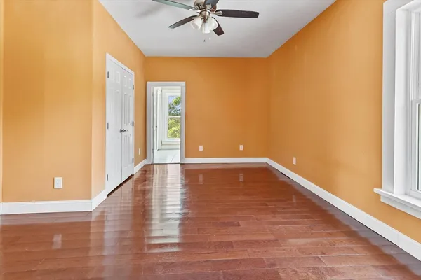 an aerial view of a house with a yard